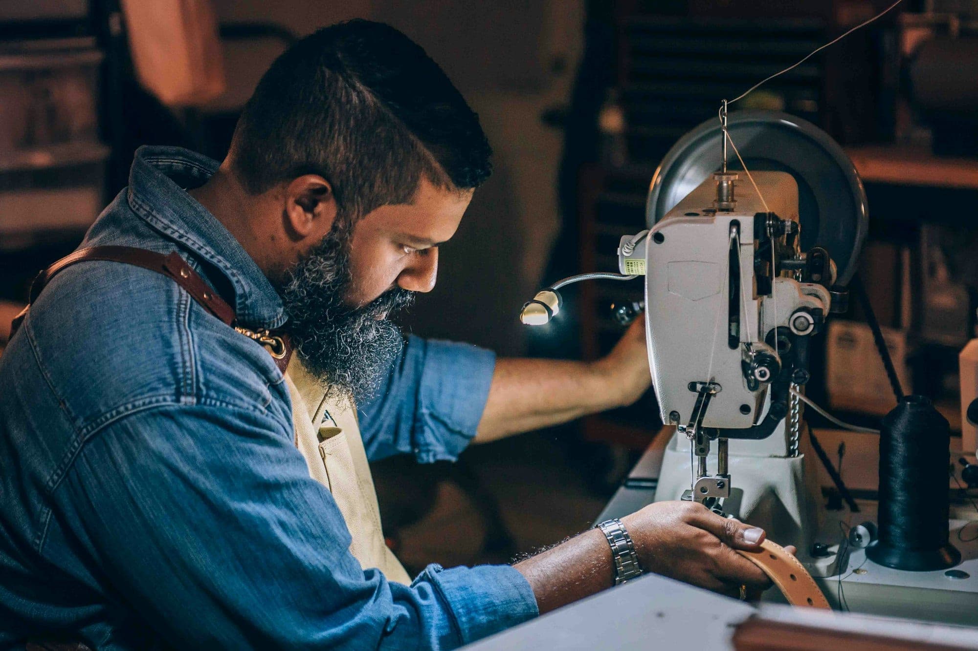 Machinist working a garment on an industrial sewing line