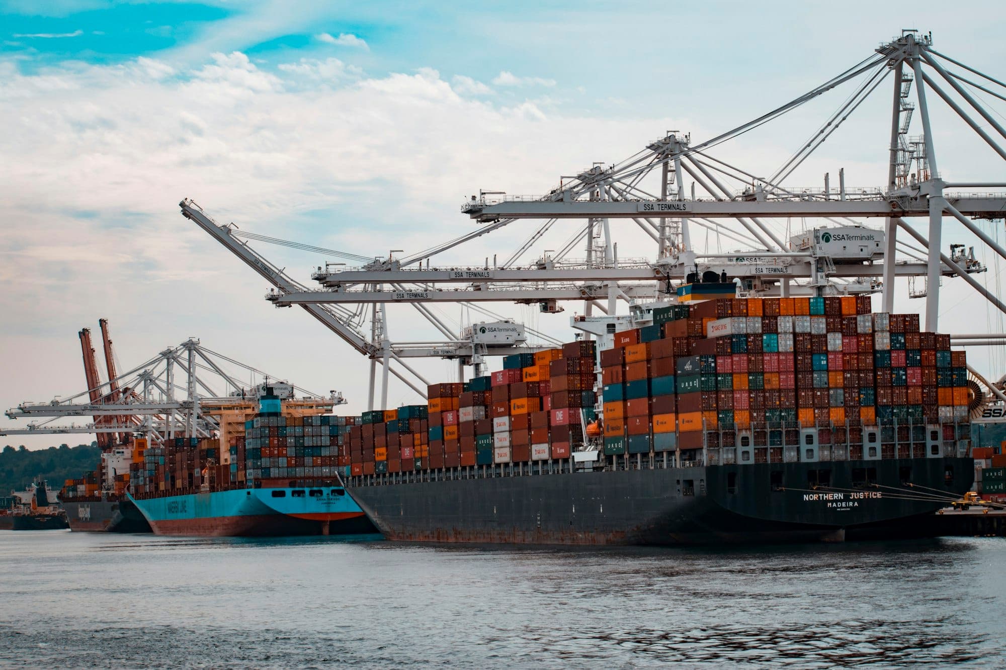 Container vessel loading alongside quay cranes